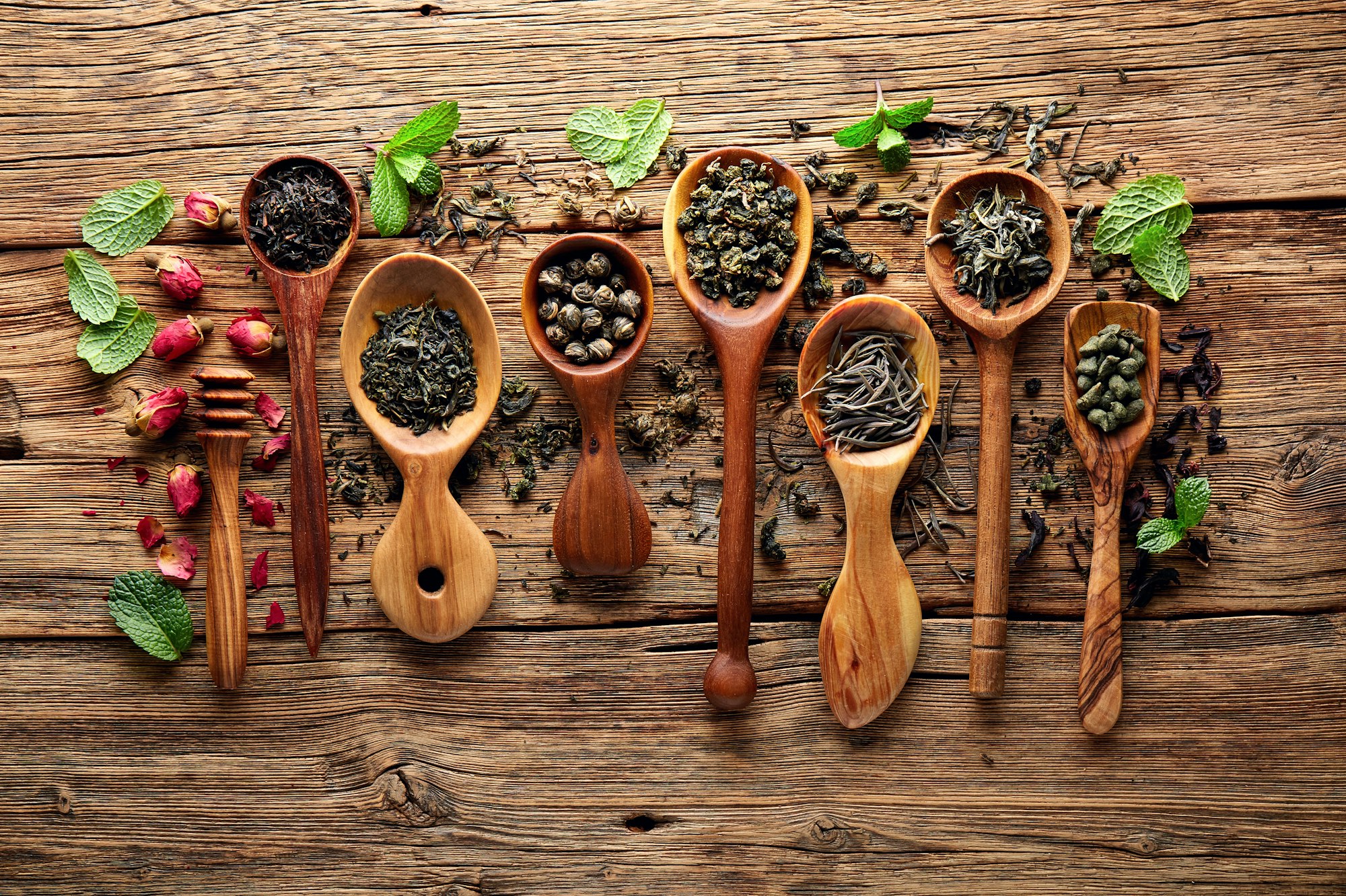 Tea leaves collection on wooden board